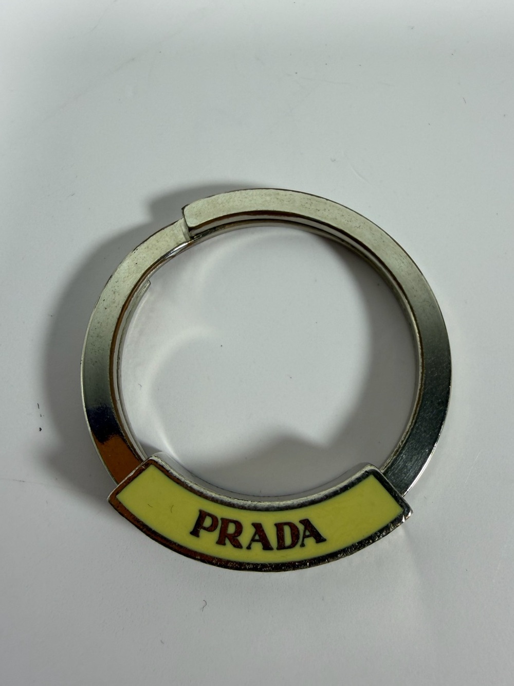 9037: Prada Yellow Enamel Silver-Tone Logo Key Ring Keychain